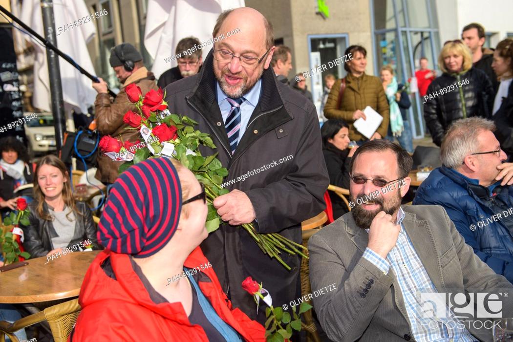 Stock Photo: German Social Democrat (SPD) chancellor candidate Martin Schulz gives out roses to local people at the St. Johanner Market in Saarbruecken, Germany.