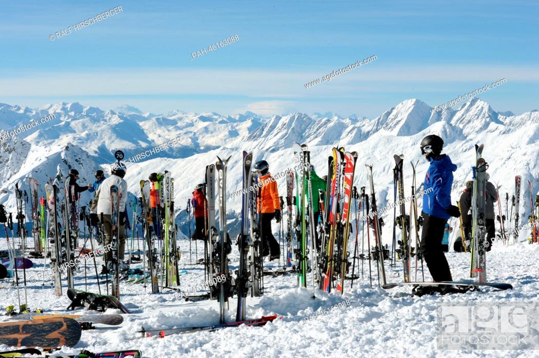 Stock Photo: Tourists stand next to skis on the 2, 900 meter high Eggishorn on a sunny day in Fiesch, Germany, 06 February 2014. Photo: RALF HIRSCHBERGER | usage worldwide.