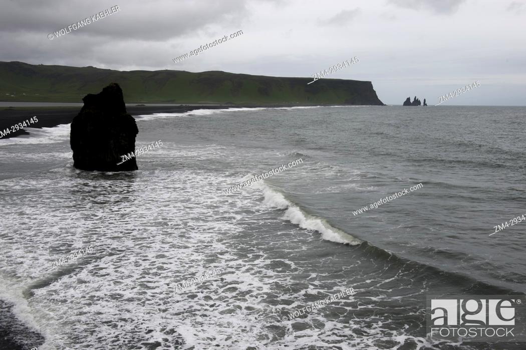 Stock Photo: A sea stack at Dyrholaey, a small peninsula, or promontory, is located on the south coast of Iceland, not far from the village Vík.