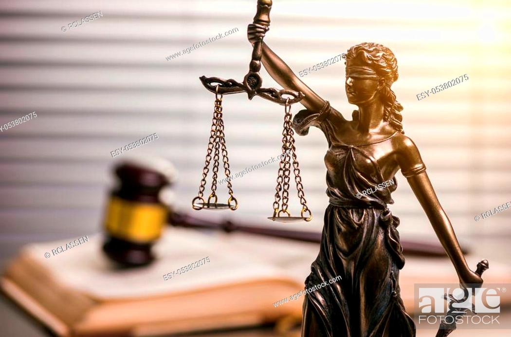 Stock Photo: View from the side of the Statue of Justice the Roman goddess in a lawyer office. ideal for websites and magazines layouts.