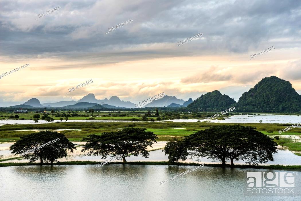 Imagen: Sunset above tower karst mountains, artificial lake, landscape in the evening light, Hpa-an, Karen or Kayin State, Myanmar.