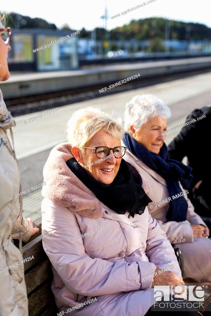 Stock Photo: Senior women waiting at train platform.