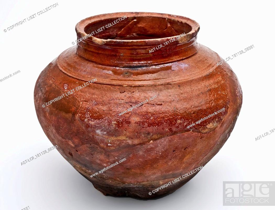 Stock Photo: Earthenware cooking pot or storage jar on stand fins with cylindrical neck, storage jar holder soil find ceramic earthenware glaze lead glaze.
