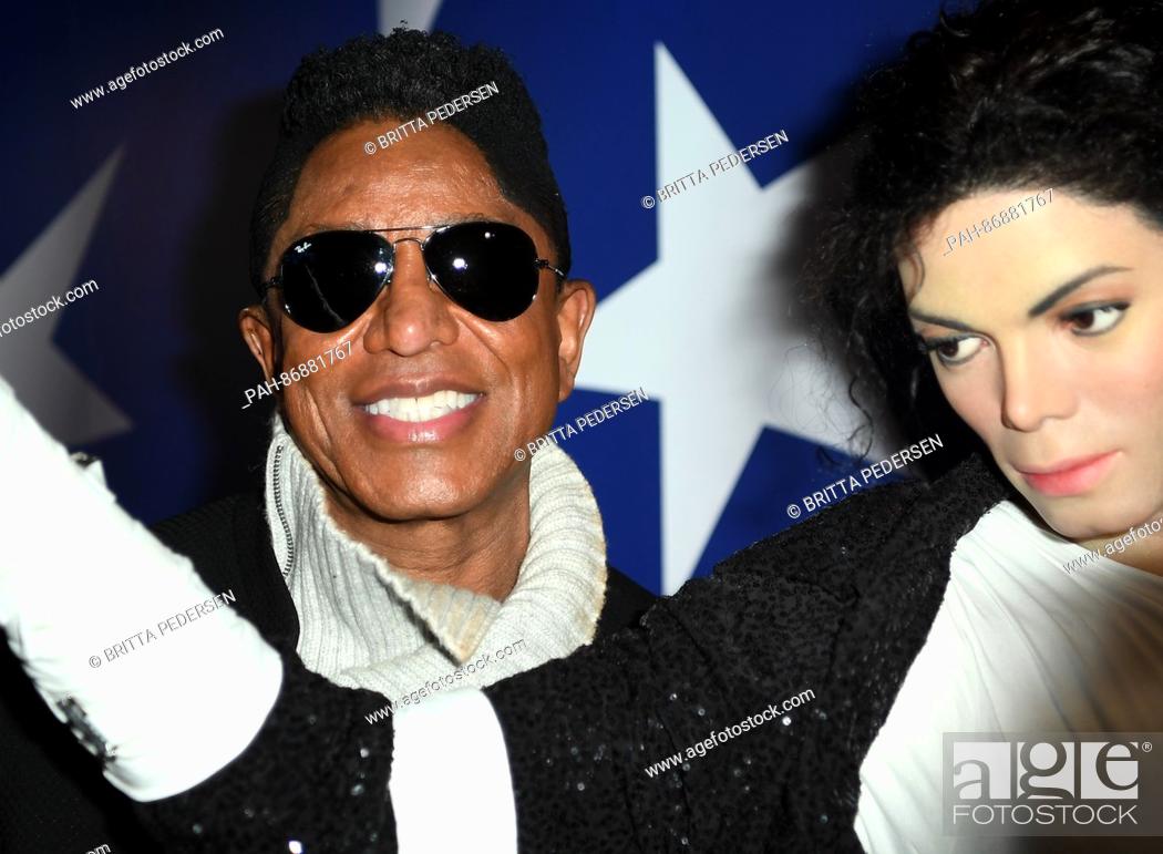 Stock Photo: The US singer Jermaine Jackson (L) standing next to the wax figure of his brother Michael Jackson at the Madame Tussauds wax museum in Berlin, Germany.