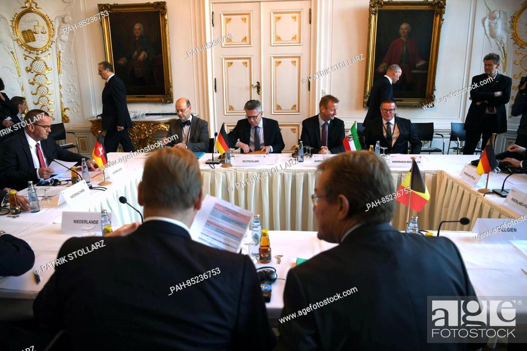 Stock Photo: Belgium's Finance Minister Johan van Overtveldt (foreground, R) talks with Dutch Minister of Security and Justice Ard van der Steur (forground.