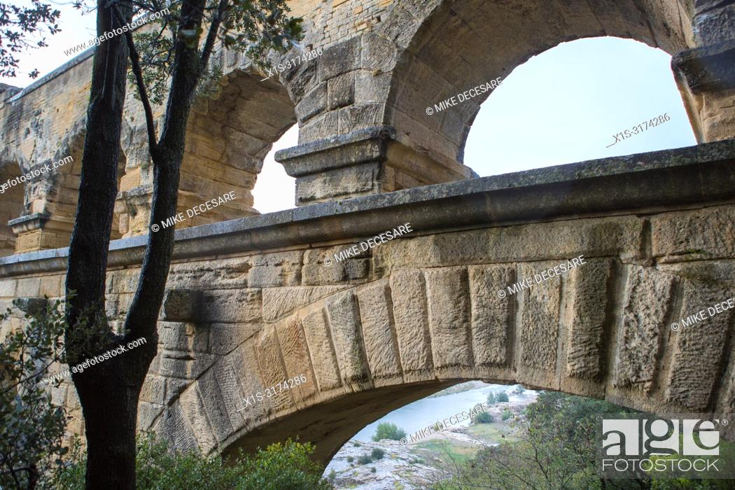 Stock Photo: Pont Du Gard, an aqueduct in the south of France, was build by the Romans to distribute water to communities throughout their empire.