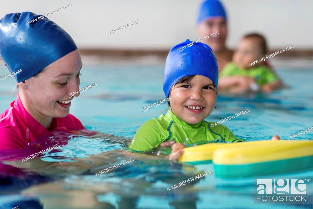 Stock Photo: Little boy learning to swim.