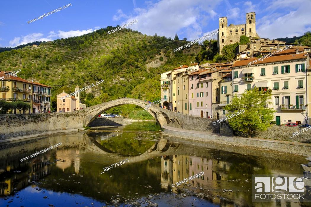 Stock Photo: Old arch bridge, Ponte Vecchio over the Nervia river with Castello di Dolceacqua, Dolceacqua, Riviera, Liguria, Italy, Europe.