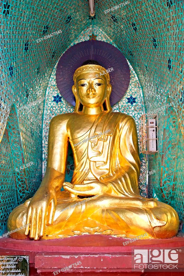 Stock Photo: Buddha image at the Shwedagon Pagoda, a gilded stupa located in Yangon, Myanmar. The 99 metres tall pagoda is situated on Singuttare Hill.