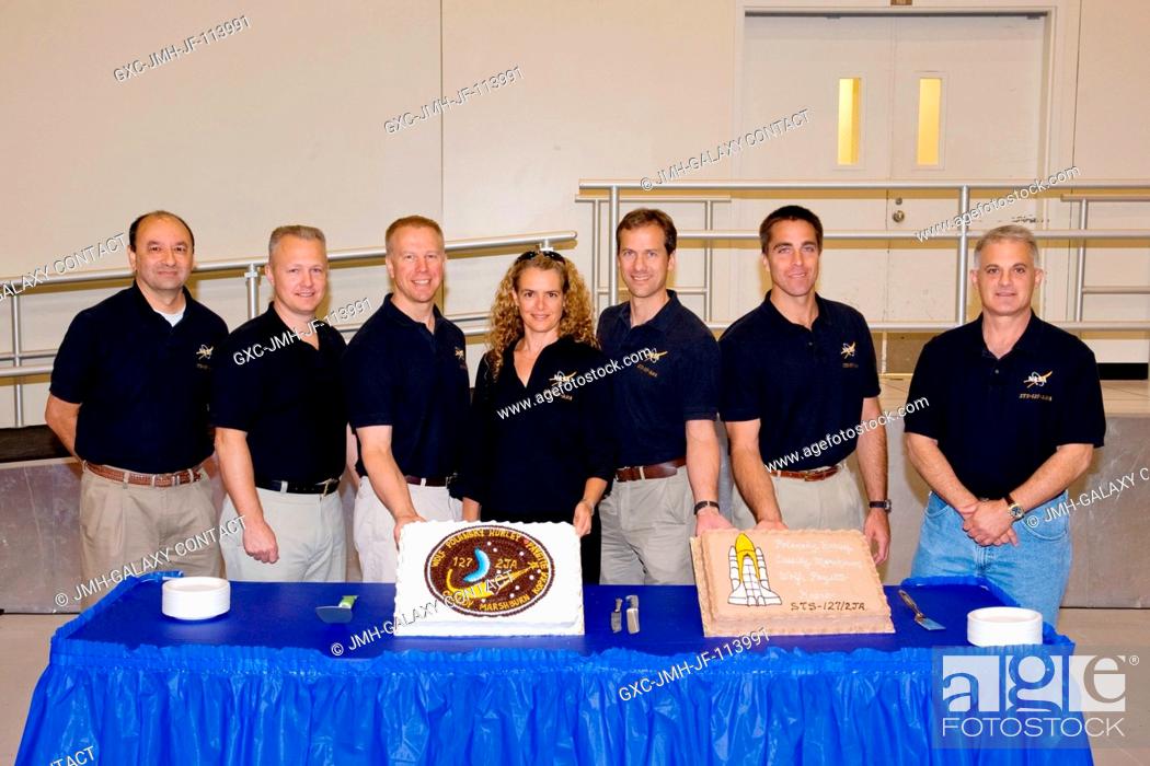 Stock Photo: The STS-127 crew members celebrate the end of formal crew training with a cake-cutting ceremony in the Jake Garn Simulation and Training Facility at NASA's.
