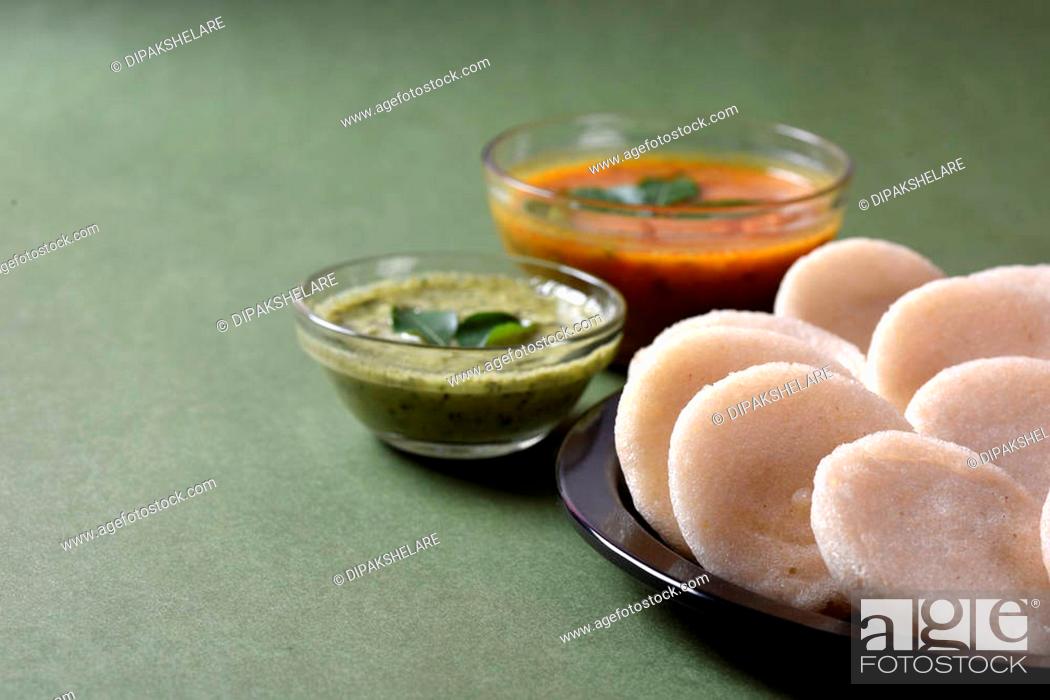 Stock Photo: Idli with Sambar and coconut chutney, Indian Dish: south Indian favourite food rava idli or semolina idly or rava idly, served with sambar and green chutney.
