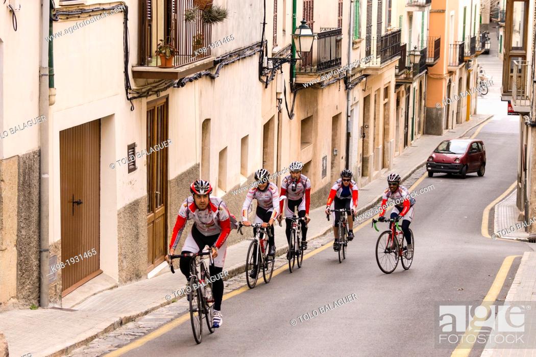 Stock Photo: cyclists crossing the village of Bunyola, mallorca, Balearic Islands, Spain, Europe.