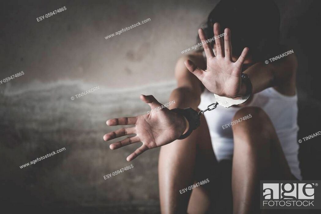 Stock Photo: Woman's hands in handcuffs, Stop violence against Women, human trafficking Concept, Human rights Day concept. international women's day.