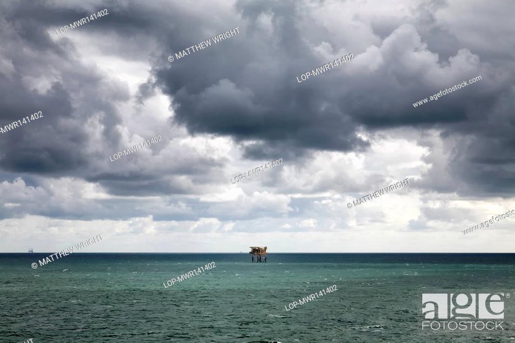Stock Photo: Scotland, Aberdeen, North Sea. Oil platform and gathering storm.