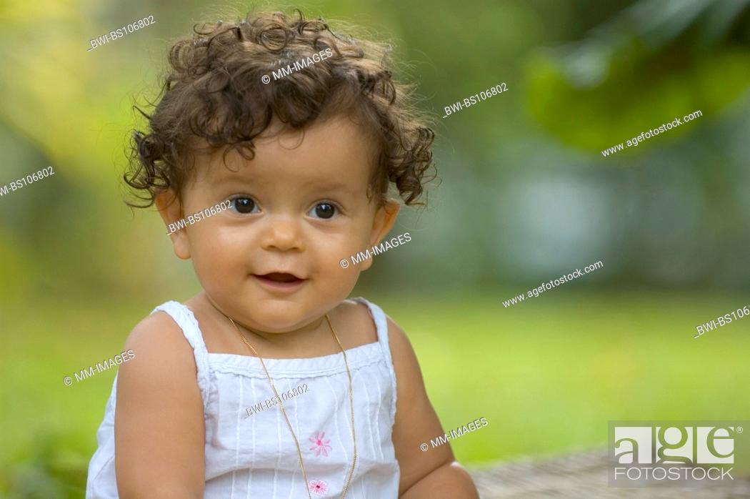sweet baby with dark curly hair, Stock Photo, Picture And Rights Managed  Image. Pic. BWI-BS106802 | agefotostock