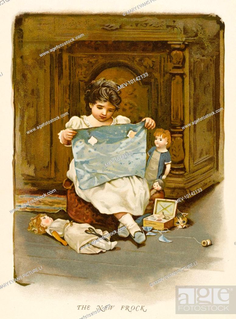Stock Photo: A little girl makes some new clothes for her dolls.