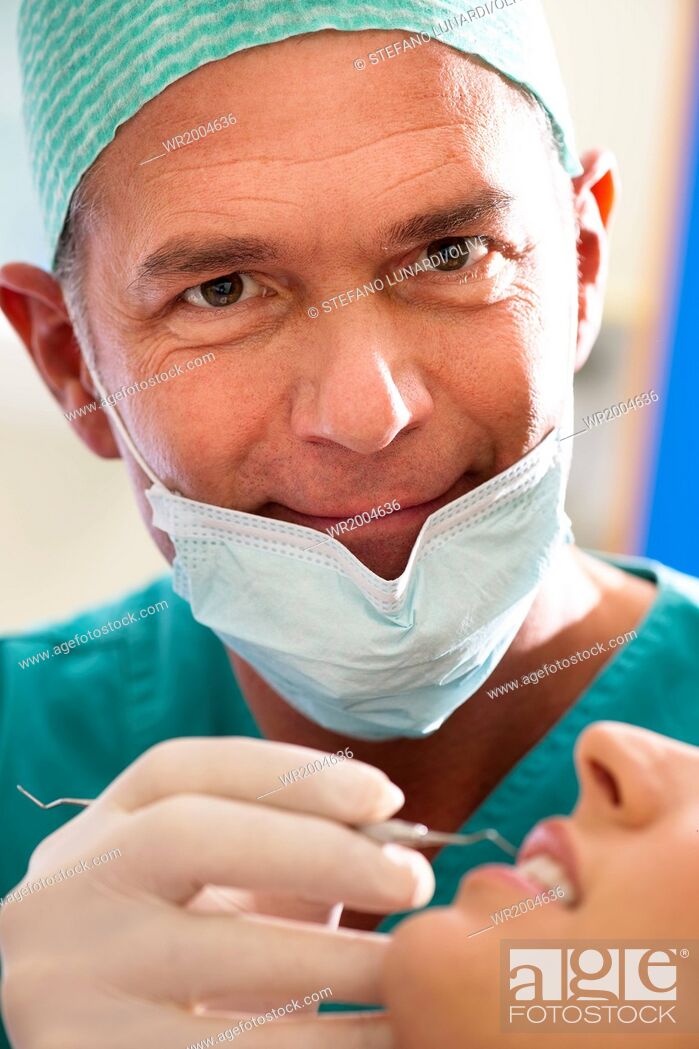 Stock Photo: Portrait of a male dentist at work.