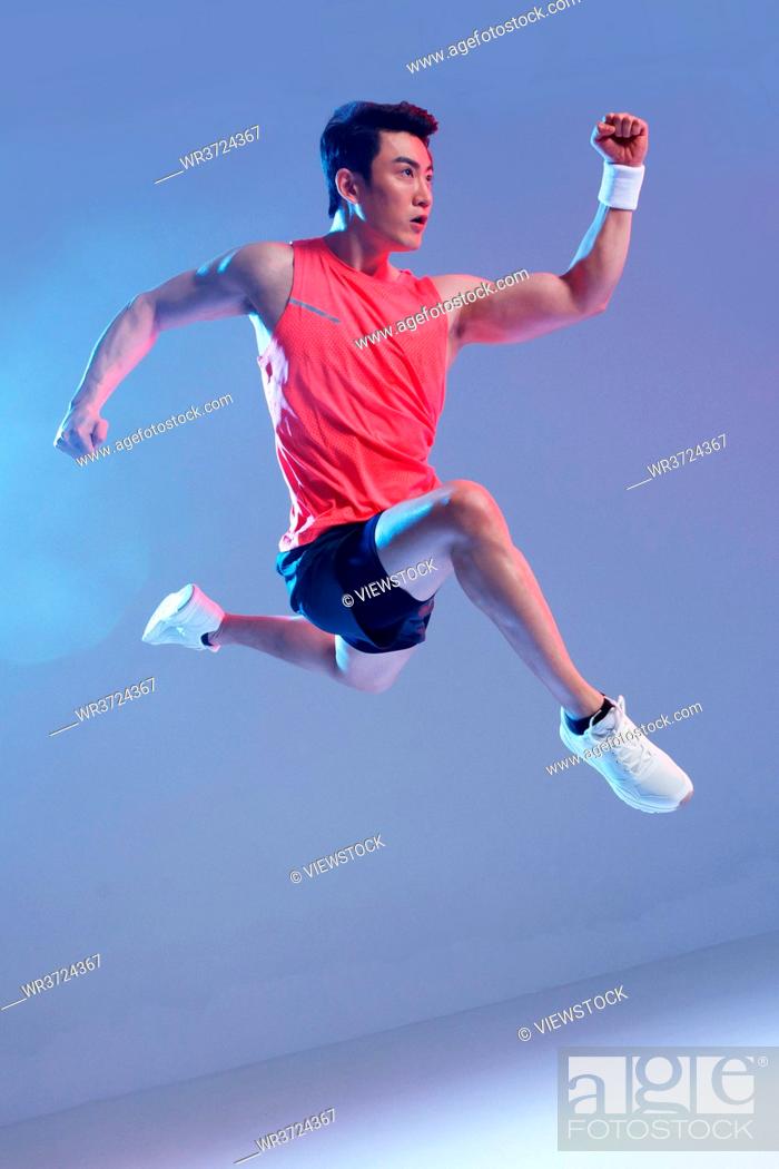 Stock Photo: Running jump athletes.