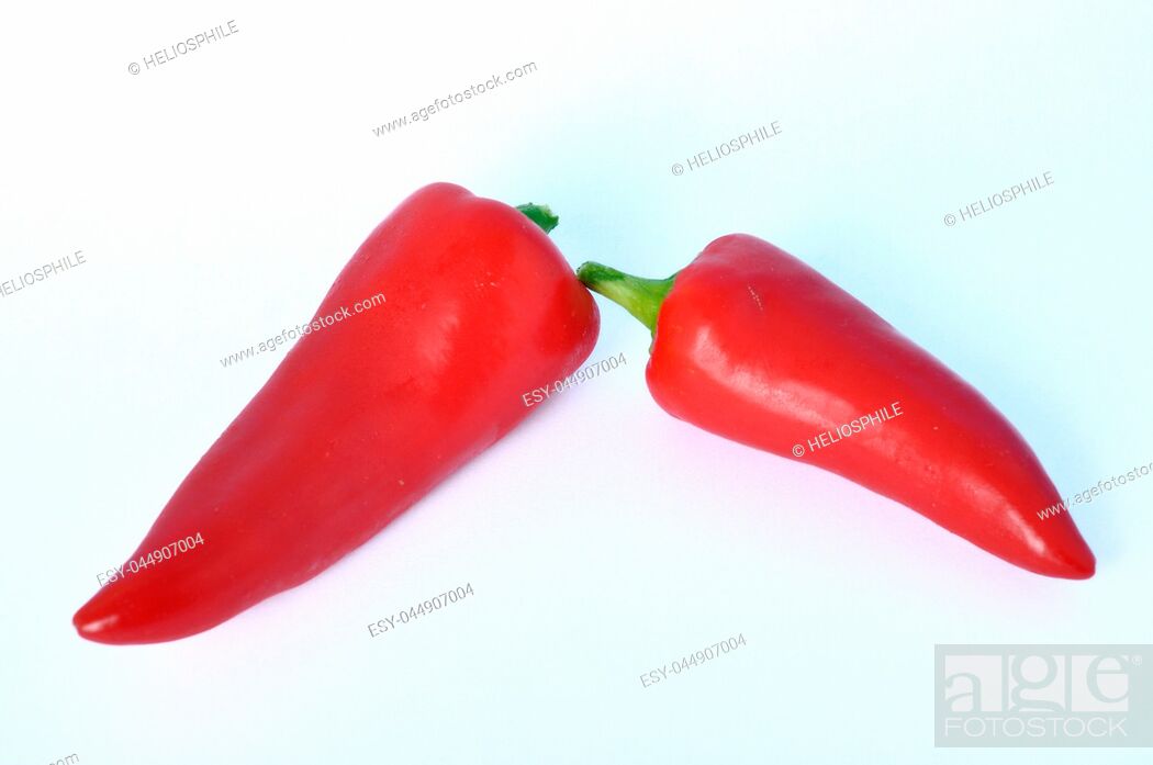 Stock Photo: Red long pepper on white bacground.