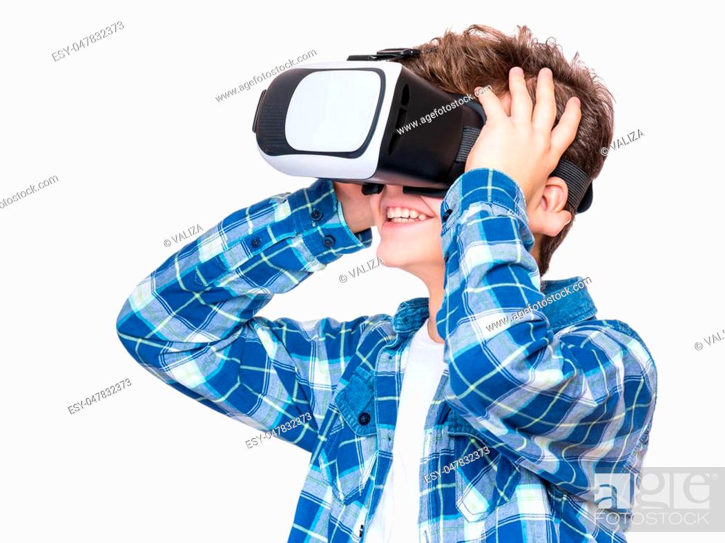 Happy teen boy wearing virtual reality goggles watching movies or playing  video games, Stock Photo, Picture And Low Budget Royalty Free Image. Pic.  ESY-047832373 | agefotostock