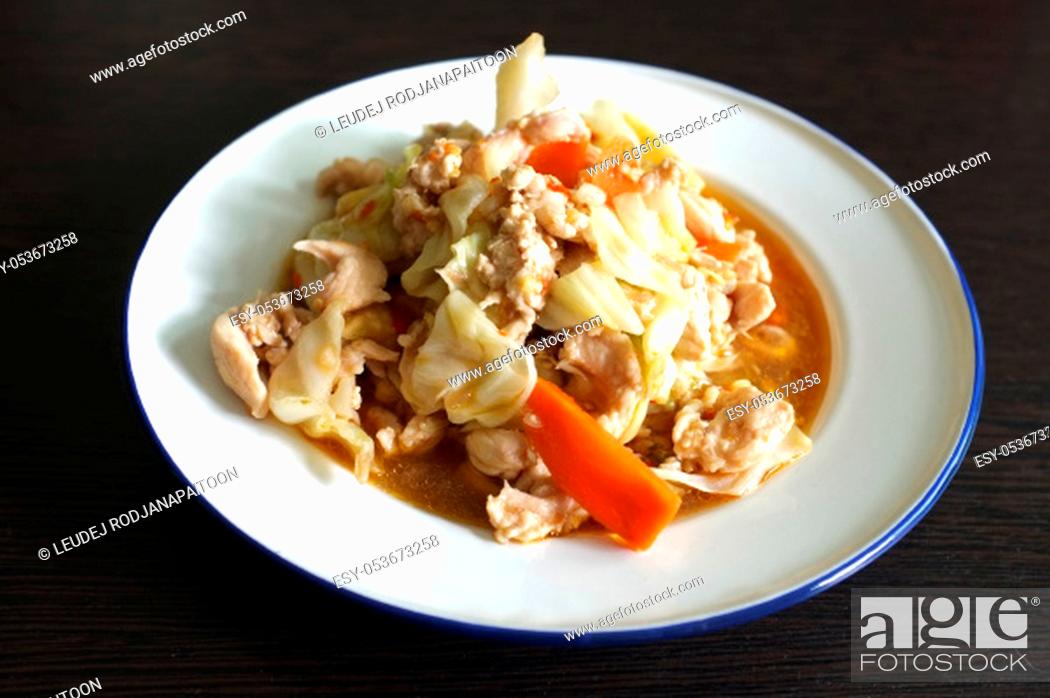 Stock Photo: Stir fried slice cabbage and pork with fish sauce.