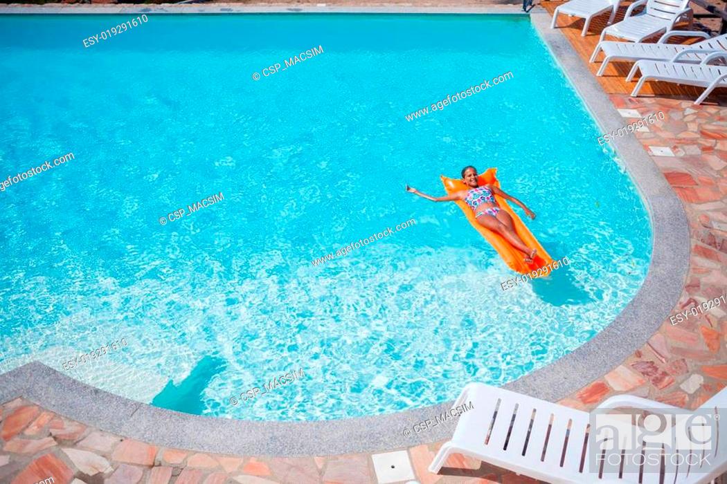 Stock Photo: Girl at swimming pool.