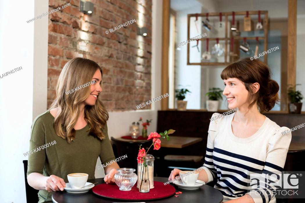 Stock Photo: Two best friends sitting in a coffee shop.