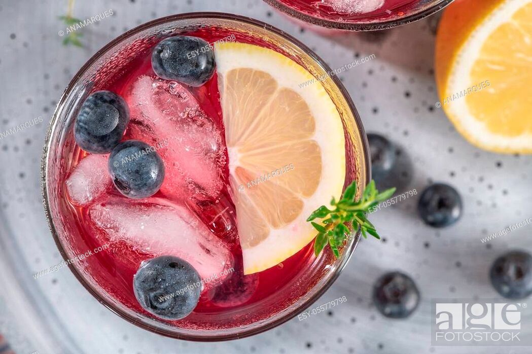 Stock Photo: Fresh blueberry summer mojito cocktail. Blueberry lemonade or sangria on kitchen countertop.