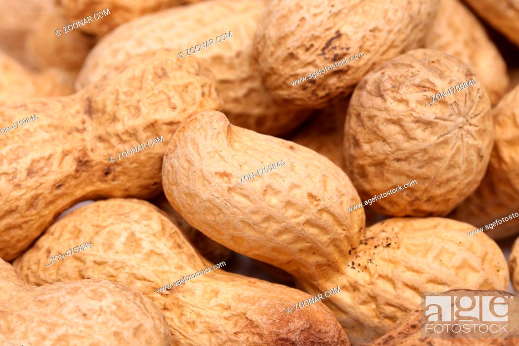 Stock Photo: close-up of some peanuts. background of some peanuts.