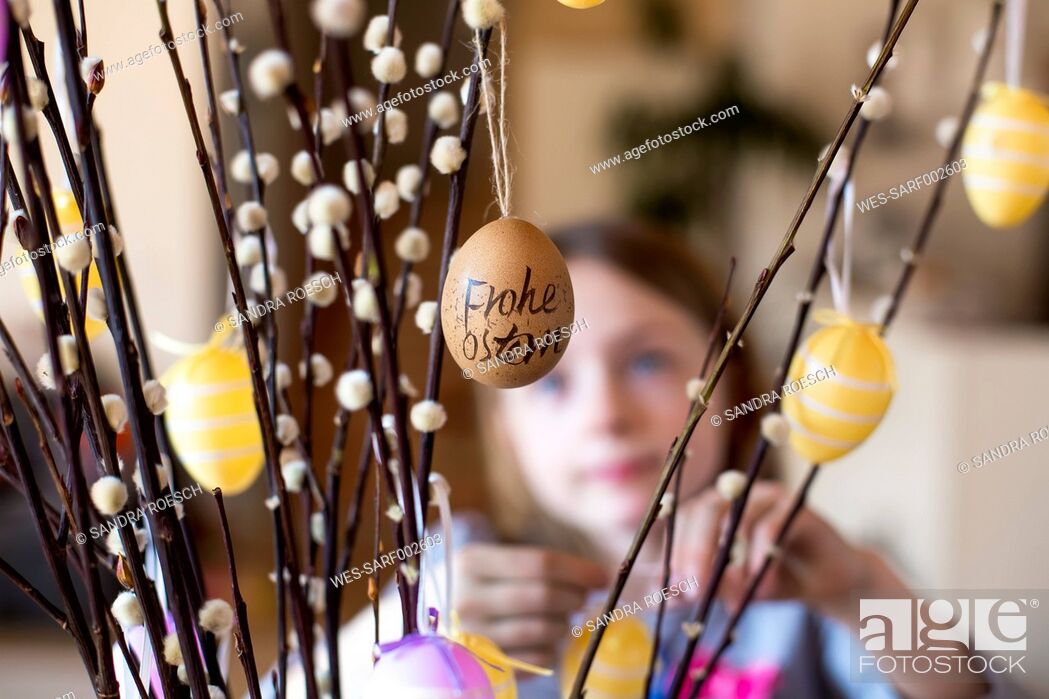 Stock Photo: Easter egg hanging on twig of pussy willow.