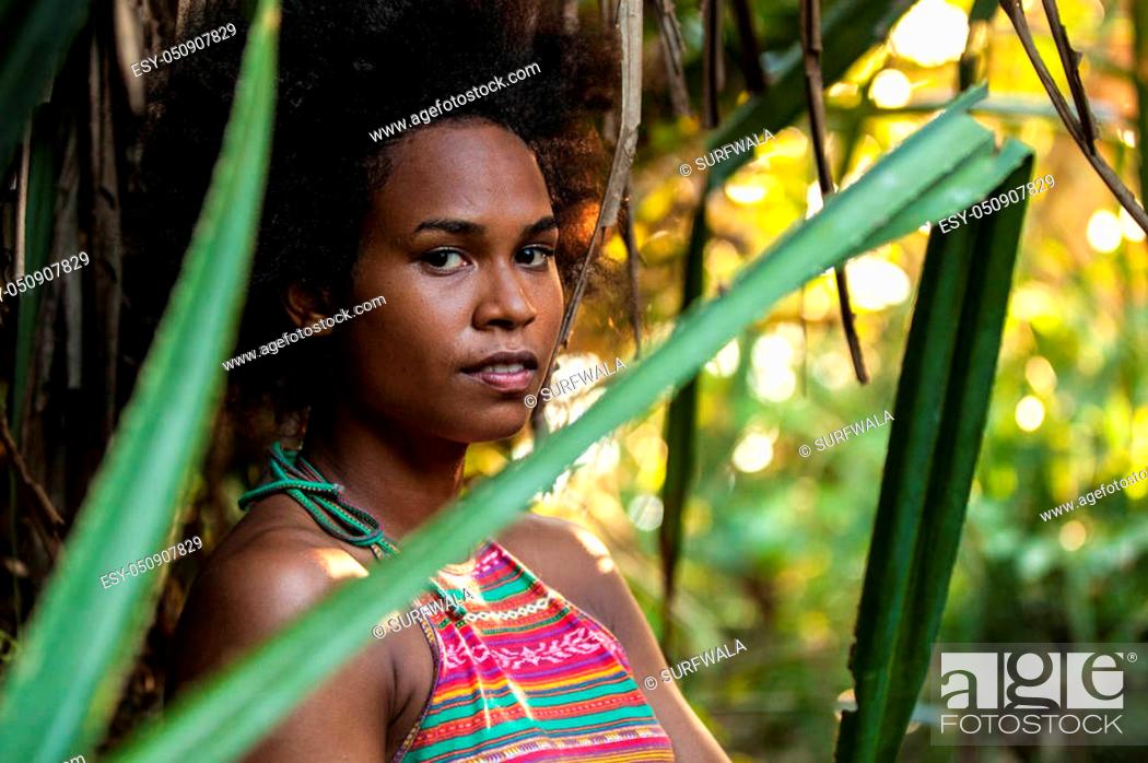 Melanesian pacific islander athlete girl with afro hair style in the  jungle, half profile, Stock Photo, Picture And Low Budget Royalty Free  Image. Pic. ESY-050907829 | agefotostock