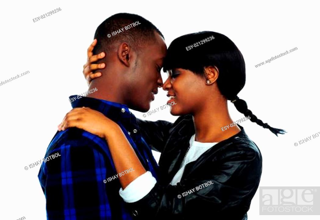 Stock Photo: Young female about to kiss her boyfriend.