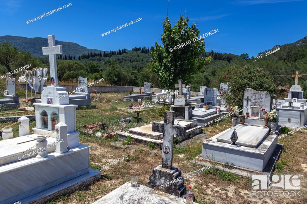 Stock Photo: Graves on a cemetery near Vouniatades village on the Greek island of Corfu.