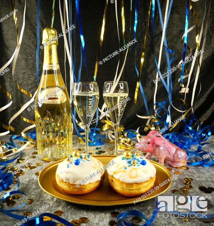 Stock Photo: 30 December 2022, Berlin: Symbolic image on the theme of New Year's Eve, New Year, luxury culinary. A bottle of Champagne Diamant from Vranken Pommery.