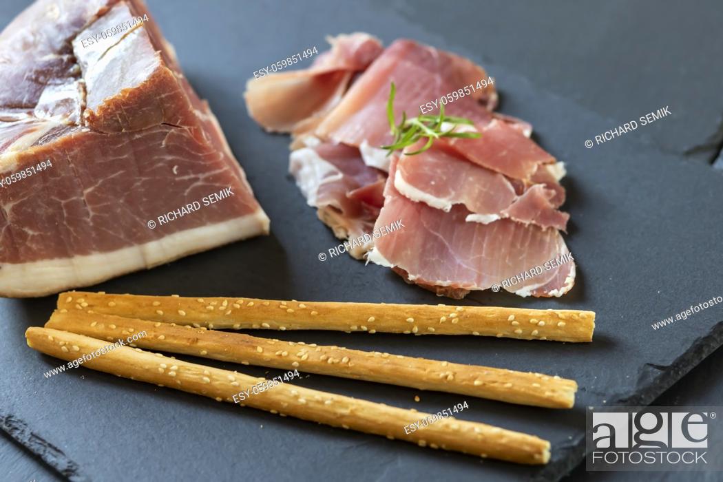 Stock Photo: Italian ham served with grissini.