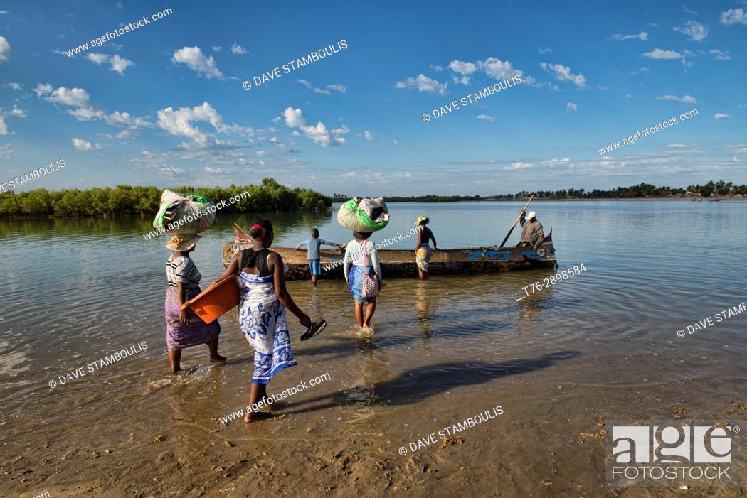 Stock Photo: Ferry crossing by pirogue on an inlet off the Indian Ocean, Morondava, Madagascar.