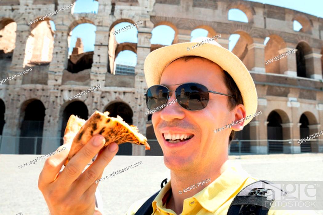 Stock Photo: Man Eating Italian Pizza Near Colosseum, Rome.