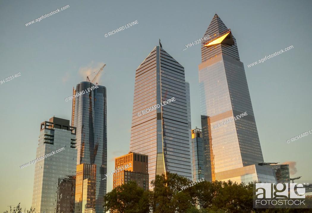 Stock Photo: 30 Hudson Yards, right, showing the cantilevered observation deck under construction, in Hudson Yards in New York on Saturday, November 3, 2018.