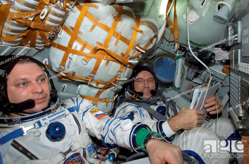 Stock Photo: Cosmonaut Yury I. Onufrienko (left) and astronaut Carl E. Walz, Expedition Four mission commander and flight engineer, respectively, wearing Russian Sokol suits.