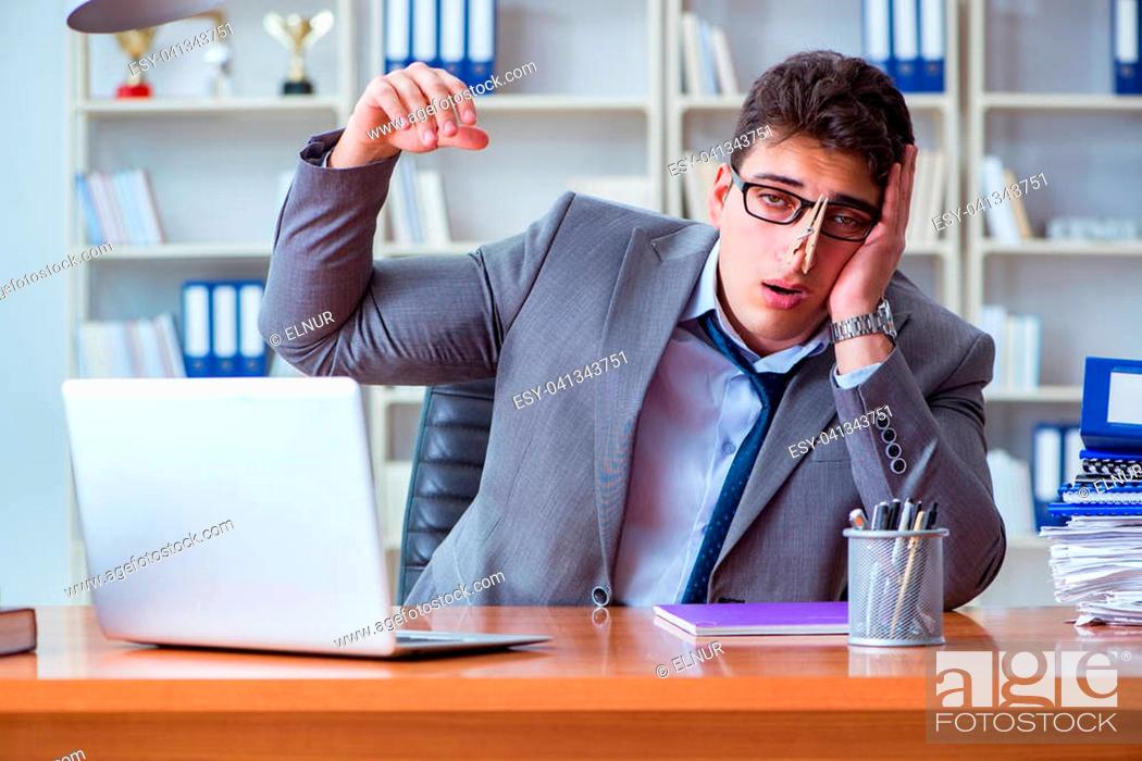 Stock Photo: Businessman sweating excessively smelling bad in office at workplace.