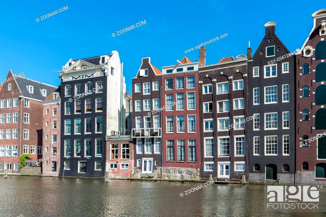 Stock Photo: Cityscape of Amsterdam city with historic houses along Canals.