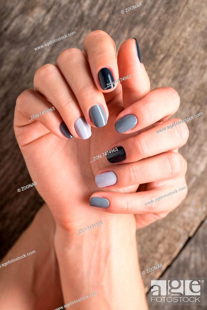Beautiful hands with the miniature painted in a gray-colored nail polish,  Stock Photo, Picture And Rights Managed Image. Pic. ZON-7474963 |  agefotostock