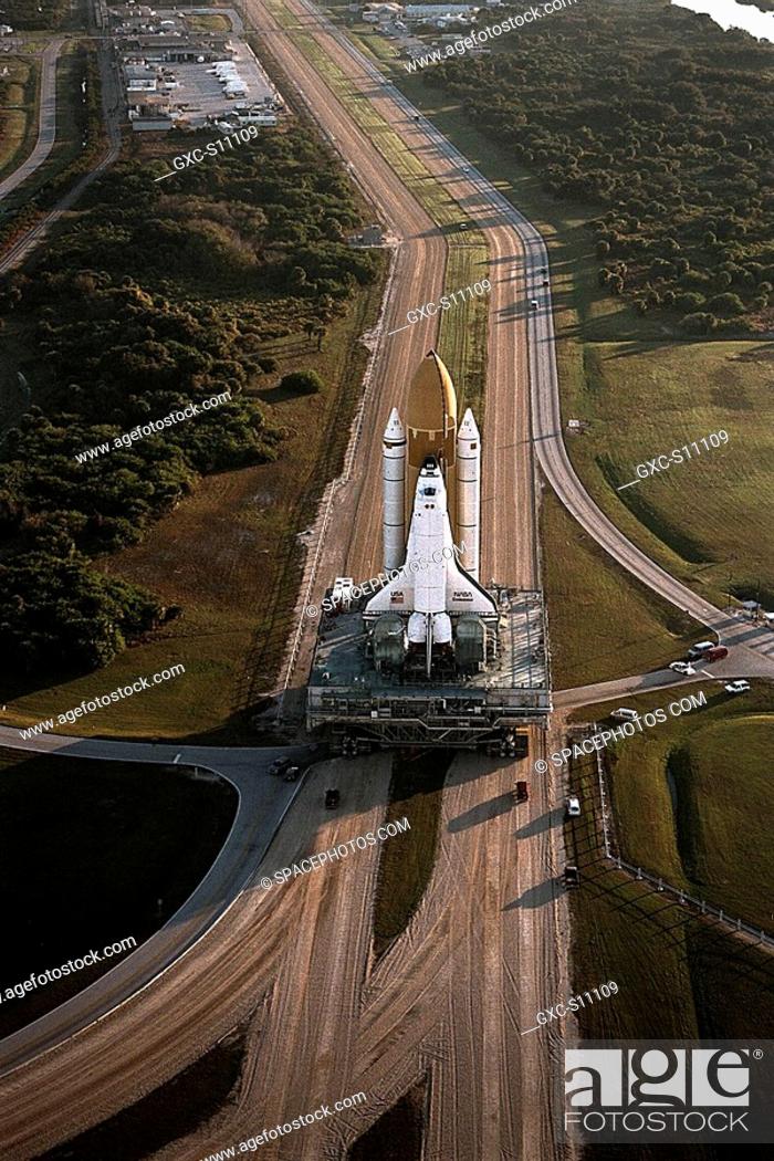 Stock Photo: 12/19/1997 -- The Space Shuttle Endeavour rolls out to Launch Pad 39A, the destination of its 3.4-mile journey from the Vehicle Assembly Building.