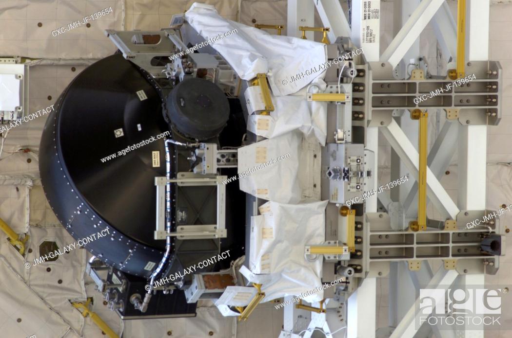 Stock Photo: A new Control Moment Gyroscope (CMG) sits in its cradle in the payload bay of the Space Shuttle Discovery prior to its installation on the International Space.