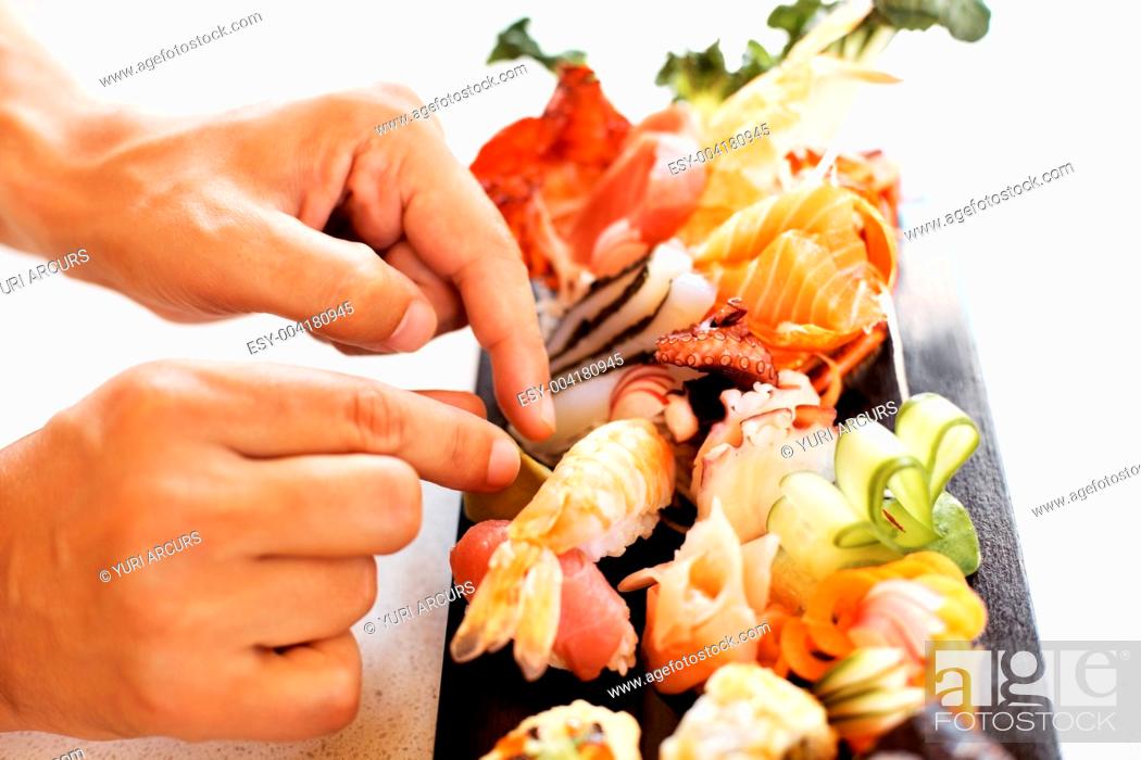 hoog favoriete vredig Sushi chef in action preparing a sushi dish at restaurant, Stock Photo,  Picture And Low Budget Royalty Free Image. Pic. ESY-004180945 | agefotostock