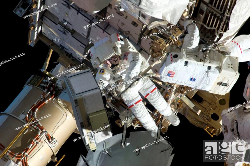 Stock Photo: Astronauts Tom Marshburn (right) and Christopher Cassidy, mission specialists for STS-127, share duties on the fourth spacewalk of Endeavour's current mission.