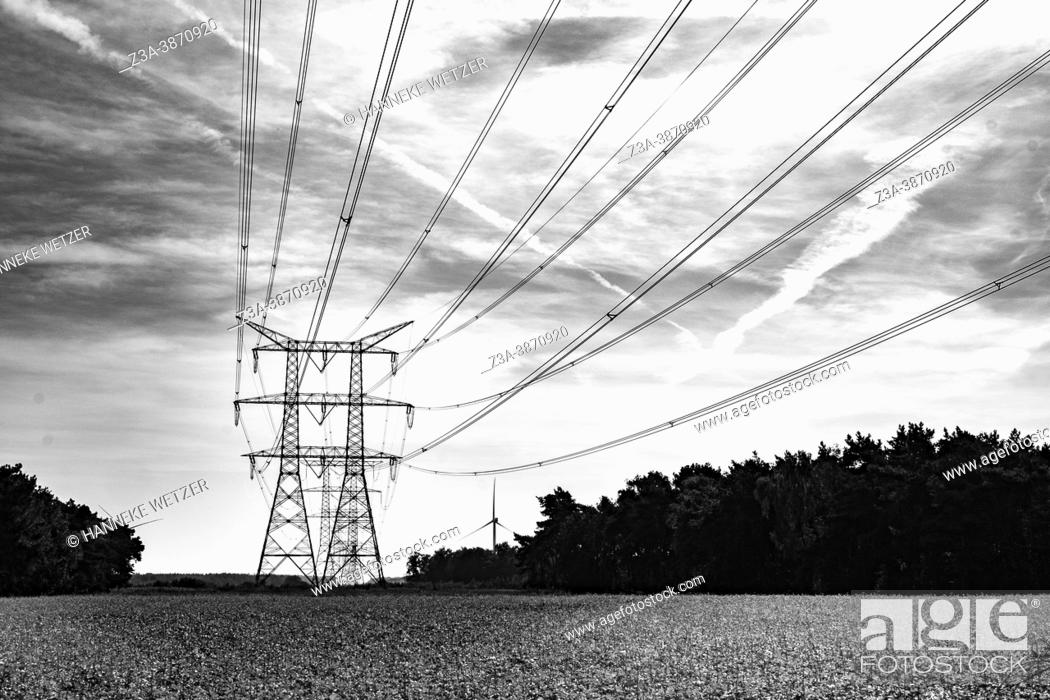 Stock Photo: A transmission tower, also known as an electricity pylon, in a Dutch landscape.