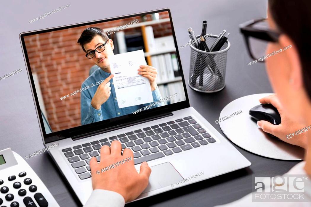 Stock Photo: Close-up Of A Businesswoman Calculating Invoice On Laptop In Office.
