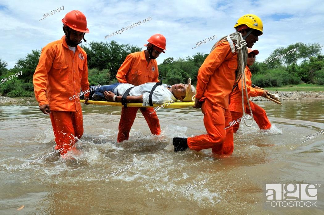 Stock Photo: Disaster prevention training in a hurricane area, evacuation of an injured person, Somotillo, Chinandega, Nicaragua, Central America.