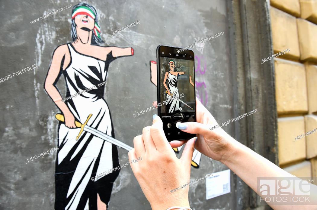 Stock Photo: Iustitia? The new work of street artist Laika in support of Mimmo Lucano, former mayor of Riace sentenced to 13 years in prison.